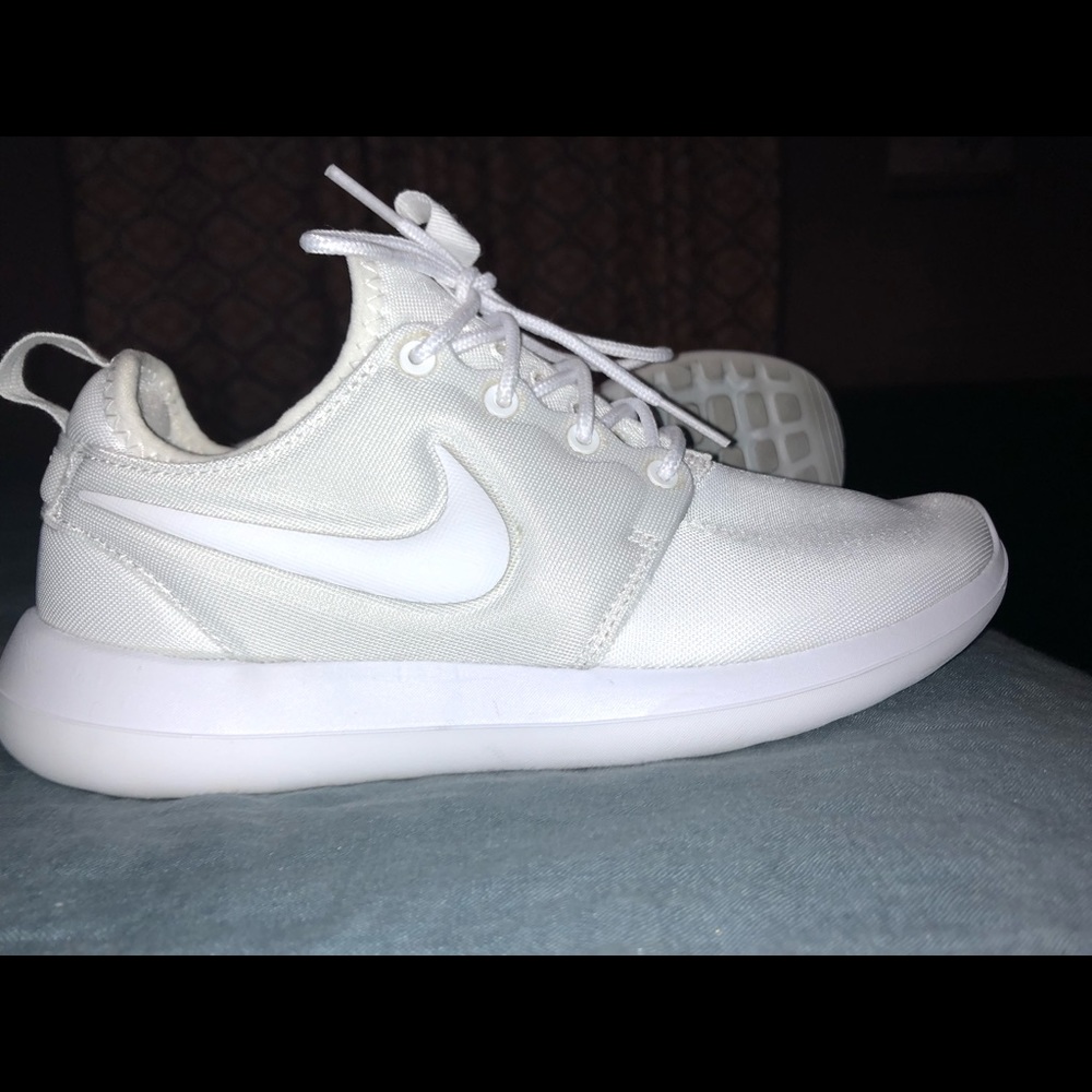 All white Nike Roshe